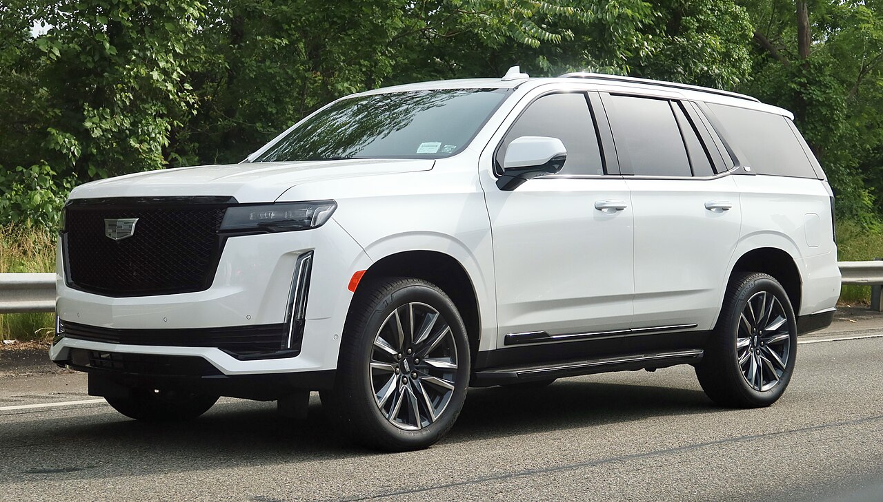 Representative white Cadillac Escalade ESV SUV; not a Royal Black vehicle or limousine conversion