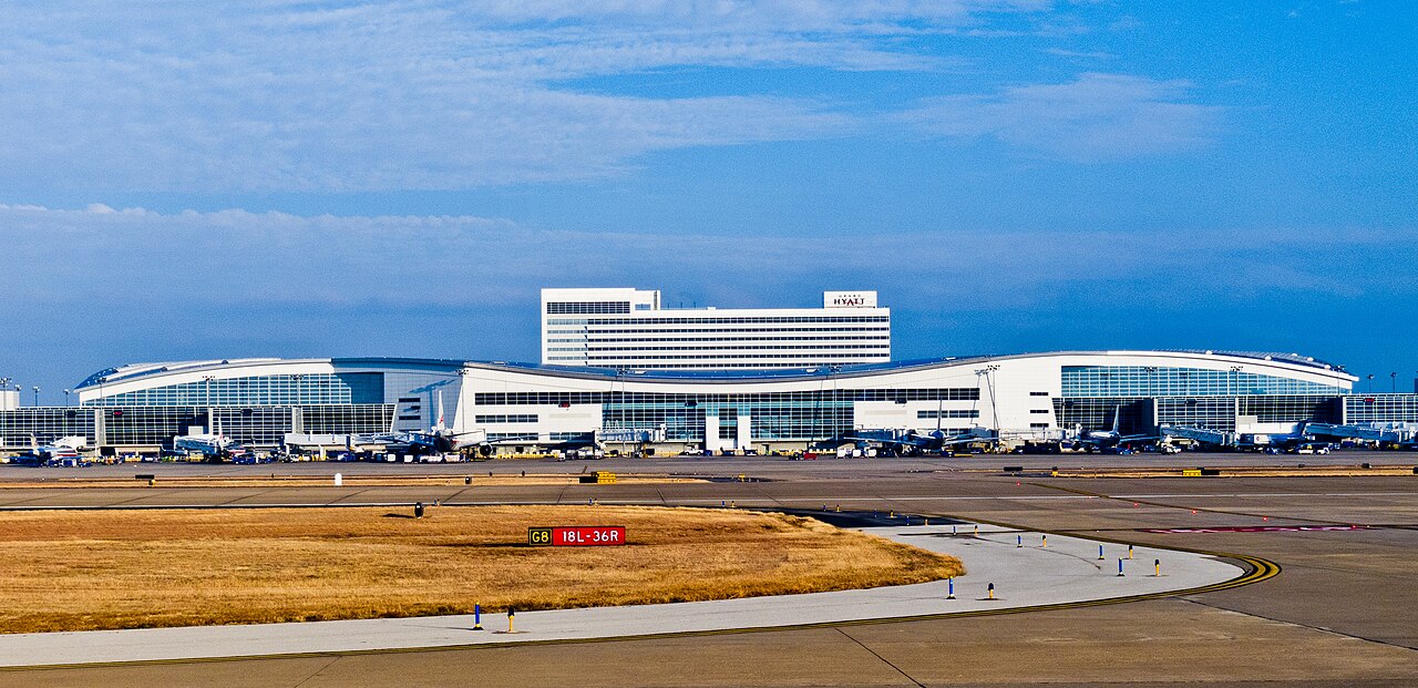 Real exterior view of DFW Terminal D and the Grand Hyatt above its airport gates
