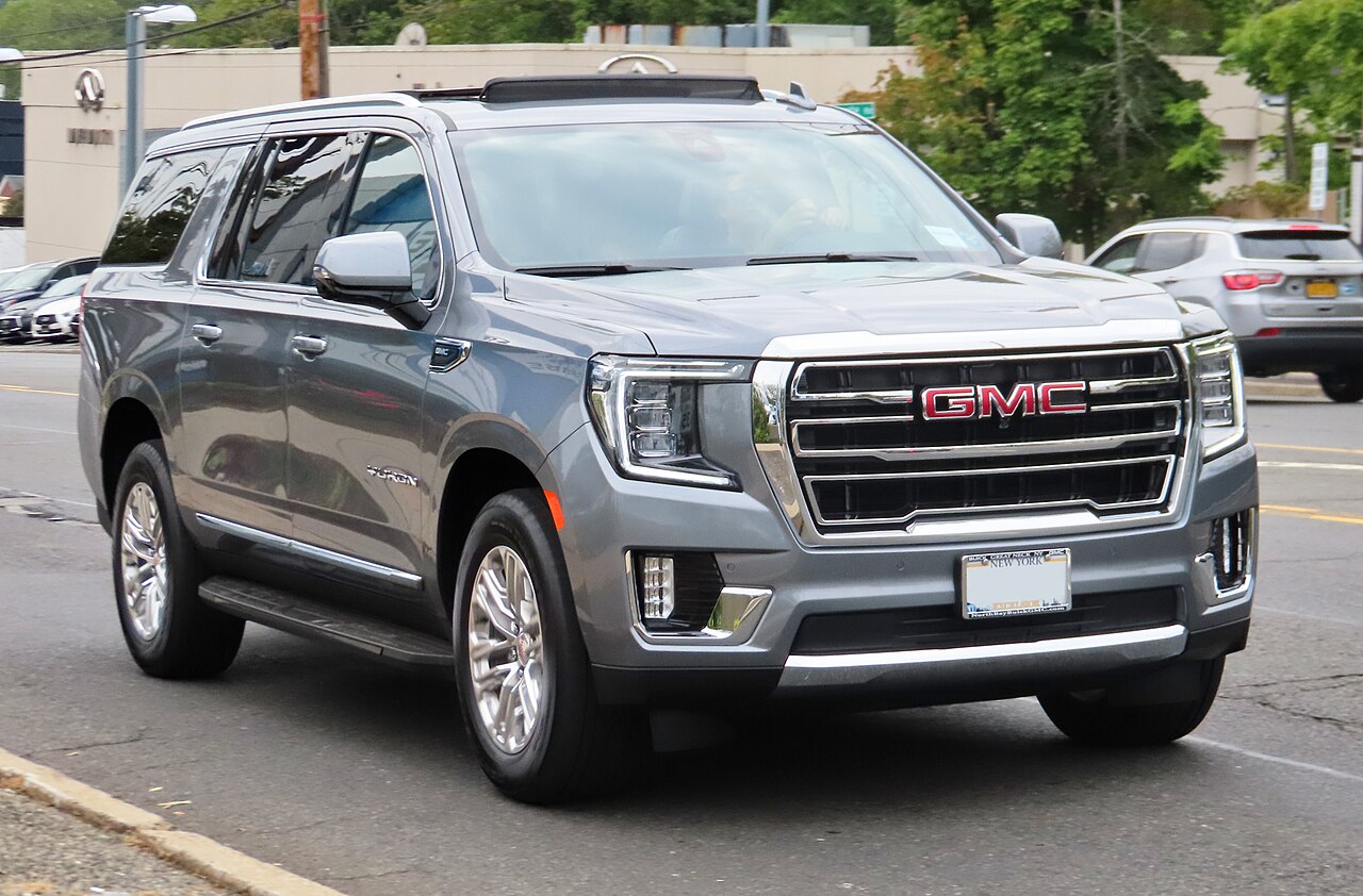 Representative gray GMC Yukon XL SLT photographed on a street; not a Royal Black fleet photograph