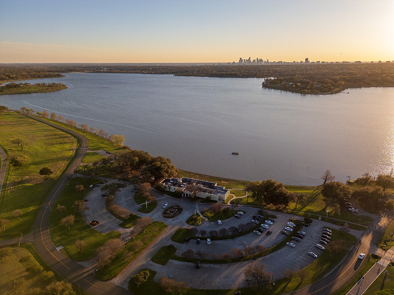 White Rock Lake with the Bath House Cultural Center and the Dallas skyline in the distance